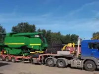 Перевозка негабаритного груза тралами.Транспортировка комбайнами