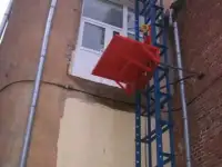 Консольный грузовой подъемник(мачтовый).