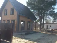 Бригада строителей строит котедж гараж баню помещений под ключ