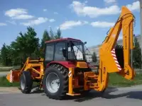 Экскаватор-погрузчик 702ЕМ